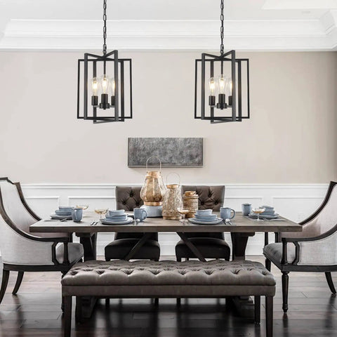 Straight Up Matte Black 3 Light Farmhouse Chandelier With Adjustable Height And Solid Metal Cage Build hanging over a dining table.