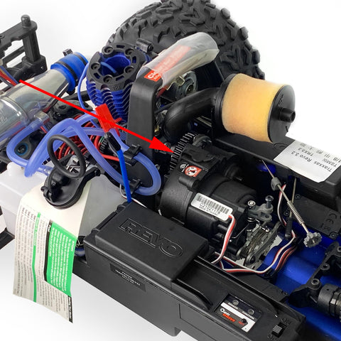Close-up of a Traxxas E-Revo 2.0 RC car chassis with Sturdy Steel 48T M1 Spur Gear Set For One Tenth Scale RC Cars Upgrade Fits Traxxas Arrma Losi HPI Savage Hobao Revo Two Point Zero Includes Seven Gear Teeth For More Gear Ratios Smoother Power And Tougher Durability installed