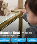 Child touching a table edge with Bonk Free Household Furniture Edge Guard For Baby Proofing And 16 Foot Pre Taped Clear Corner Protectors.