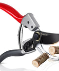 Effortless Pruning Shears For Gardeners With Safety Lock And Sharp SK5 Steel Blade Up To One Inch Cut Capacity cutting a branch