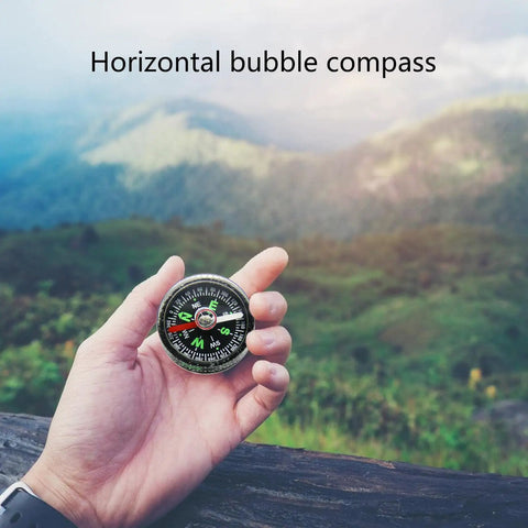 Compact Bubble Compass For Hiking And Camping, Ultra Portable Pocket Navigation Tool With Clear Green Dial held outdoors