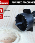 Close-up of Pro Grade Hole Saw Kit 19-Piece Set with 3/4 Inch to 5 Inch blades drilling into wood with an electric drill