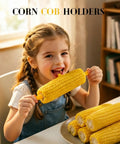 Child using Non Slip Stainless Steel Corn On The Cob Holders Set Of 20 3.54 Inch Prongs for Grillin and BBQ Cookouts.