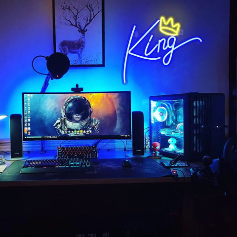 King Neon Sign Blue Letters LED Neon Light With Pink Crown Wall Decor For Bedroom Kids Room Teen Boys Room Birthday Wedding Party Bar Decor USB Powered Plug In Easy And Vibe Ready To Shine illuminating a gaming setup with blue and pink glow