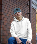 Man wearing a white hoodie and Sky Blue Adjustable Trucker Cap For Women, Washed Cotton Dad Hat With Breathable Comfort, Lightweight Summer Hat.