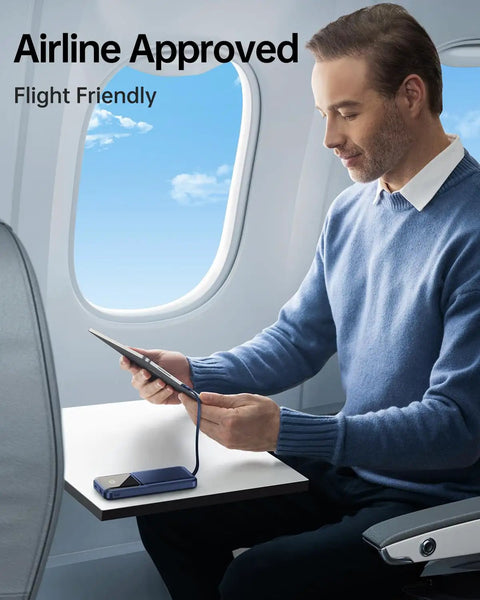 Premium Travel Essential Portable Charger Power Bank With Four Built In Cables And Hella Fast 20000mAh Capacity For Quick Device Top Offs On Drives in use on an airplane.