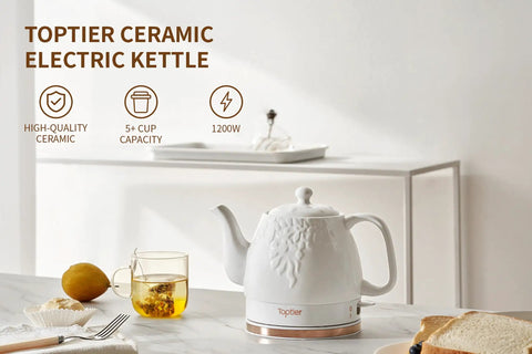 Electric Ceramic Tea Kettle With 1 Liter Capacity on a kitchen counter with teacup and lemon, modern white leaf finish, 360 swivel base.