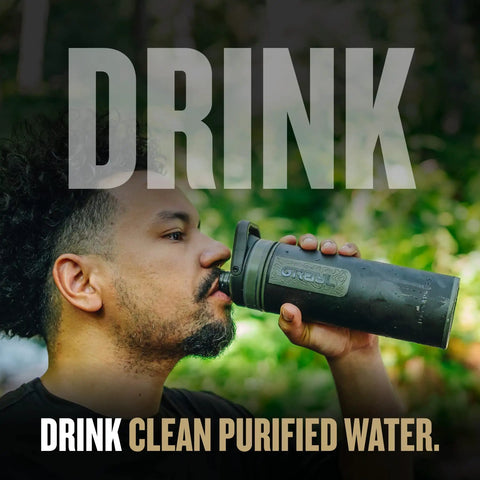 Man drinking from UltraPress Replacement Purifier Cartridge for Portable Water Purifier Bottle Orange, outdoors scene.