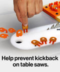 Ultimate 3D Pushblock For Woodworking Safety Delivers Rock Solid Grip And Kickback Buster Protection For Table Saws Routers Jointers And Band Saws Including Splitter Kit Parts. Hand placing splitter kit part on a table saw.