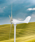Side view of 1200W Wind Turbine Generator Kit For Off-Grid Power, 12V System with 5-blade durable turbine on a green hill.