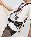 Person wearing All Around Full Body Climbing Harness For Outdoor Adventures With Thick Waist Pad And Universal Sizing, view from side