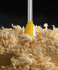 Hella Durable Six Piece Dovetail Router Bit Set Quarter Inch Shank, yellow cutter head above wood shavings.