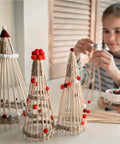 Top Shelf Unfinished Round Wooden Dowel Rods 1/4 X 18 Inch Birch Craft Sticks For Diy Projects And Home Decor 50 Pack assembled into decorative trees with pom poms.