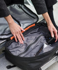 Cordless electric vacuum seal pump, interior view inside open black travel bag for storage
