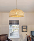 Roomy Bamboo Plug In Pendant Light With Dimmable Switch And 14 Foot Handmade Woven Cord hanging in a cozy room above a desk.
