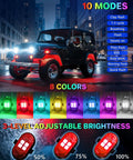 Upgraded Four Pack Wireless LED Lights For Car With Remote shown emitting multiple colors near a Jeep on city street at night.