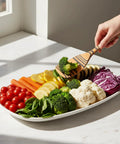 Premium Wooden Cooking Spoon Set of Three Dishwasher Safe and Heat Resistant Kitchen Utensils for Nonstick Pans stirring vegetables on a plate.