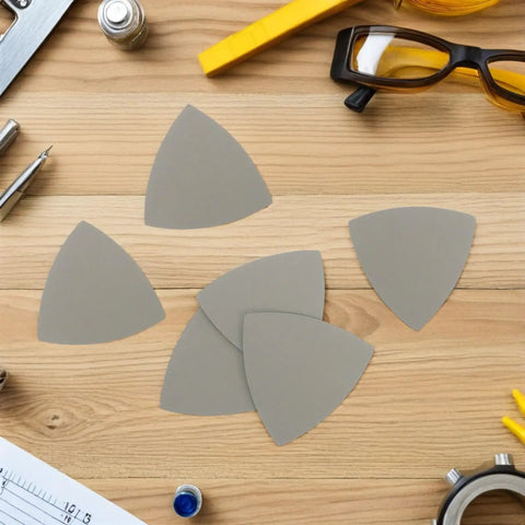 Top Rated Grit Triangular Silicon Carbide Sandpaper Sheets Waterproof Wet Dry Sanding Paper 8 Pack on a wooden surface.