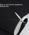 Suede headliner fabric with foam backing, black, 96 x 60 in, automotive interior roof material; close-up with scissors