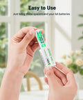 Person holding C Size Battery Adapters AA To C Converter Spacer Case 4 Pack For Rechargeable AA Cells Easy To Use Durable ABS.