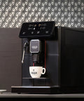 Super Automatic Espresso Machine With One Touch Brewing And On The Fly Settings To Nail Your Favorite Cups Featuring A Bright Color Screen brewing espresso in a white cup.