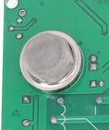 Close-up view of MQ2 smoke sensor mesh on circuit board, part of Top Shelf MQ2 Smoke Detector Module With Loud Buzzer Alert And Proven Relay Switch, Reverse Connection Guard For Kitchens And Hotels, No Sweat Plug And Play DC Setup.