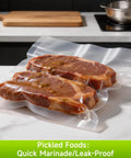 Steaks in Premium Vacuum Sealer Bags 6 Pack With 3 Rolls 11x20 And 3 Rolls 8x20 BPA Free for sous vide, on a kitchen counter.