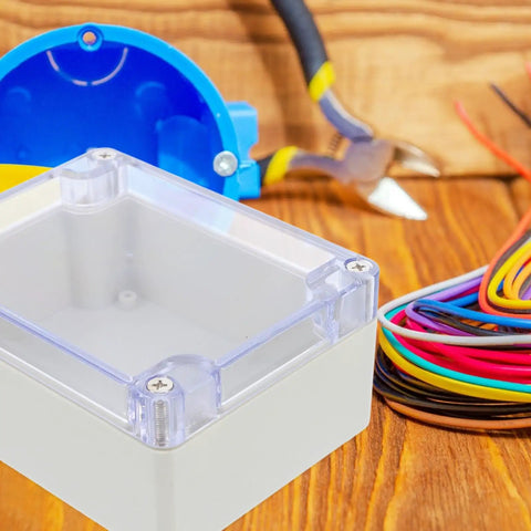 Sturdy White Plastic Junction Box With Clear Dustproof Cover For Electrical Project Setups on wood surface with wires and tools.