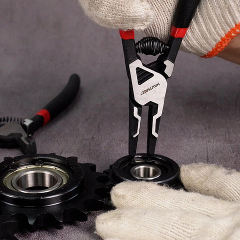 Pro-Grade 4-Piece High Leverage Snap Ring Pliers Set used to install circlip on a bearing. Chrome vanadium steel, rust-resistant.