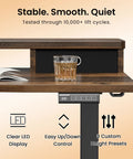 Realbear 48 By 24 Inch Electric Standing Desk With Two Convenient Drawers and a Dual Monitor Shelf featuring clear LED display and drink glass.