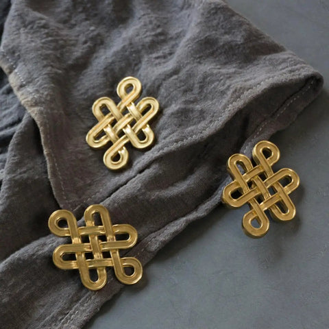 Gold Chinese Knot Cabinet Pull Handle With Single Hole Design For Wardrobes Cabinets And Dressers on fabric