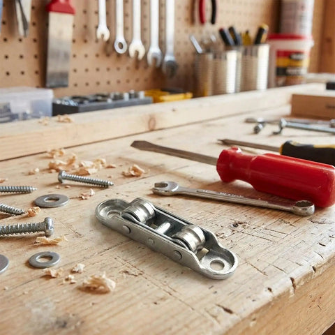 Rock Solid Double Wheel Sliding Window And Patio Door Rollers With Screws on a workbench with tools and screws.