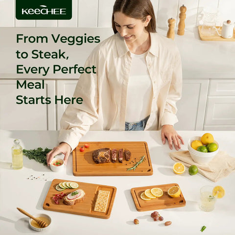 Bamboo Cutting Board Set With Deep Juice Grooves And Built In Handles used for meat, veggies, and charcuterie on a kitchen counter.