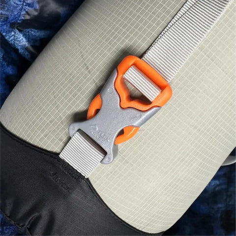 Close-up of strap and buckle on Ultralight Water Resistant Compression Stuff Sack For Sleeping Gear And Grab And Go Camping Essentials.