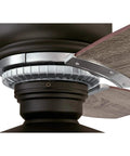 Close-up of Vintage Indoor 54 Inch Ceiling Fan with Light and Remote, weathered bronze two-tone finish blade attachment detail.