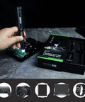 Using 42-In-1 Electric Precision Screwdriver Kit With 40 Magnetic Bits on electronic device, box with components shown
