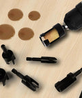 Heavy Duty Carbon Steel Wood Plug Cutter Drill Bit Set 8 Pack with hex shank bits on a wooden surface.
