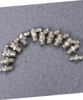 Grease Zerk Fittings Kit, 45-Piece Metric Assortment, straight and angled fittings on grey surface.