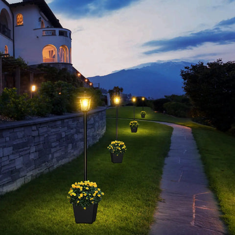 64 Inch Solar Lamp Post With Planter For Garden And Pathway, Waterproof Outdoor Lighting Poles illuminating a curved driveway