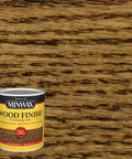Top Notch Quick Dry Oil Based Wood Stain In Classic Provincial Color enhances wood grain on a wooden surface with a paint can.
