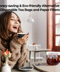 Woman enjoying tea with an Ultra Fine Mesh Tea Infuser Strainer on a table, no fuss 304 stainless steel with slim threaded lid for loose leaf tea.