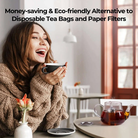 Woman enjoying tea with an Ultra Fine Mesh Tea Infuser Strainer on a table, no fuss 304 stainless steel with slim threaded lid for loose leaf tea.