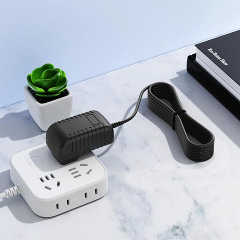 AC DC Adapter For Sewing Machines 6V Power Supply With 1.2M Cord on table with power strip and plant
