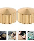 Golden metal movement nuts from 20 Piece Clock Nut Set For Repair And DIY Projects, great for clock hand stabilization