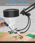 3 In 1 Solder Fume Extractor Smoke Absorber Fan Lamp With 2 Helping Hands in use at electronic workstation.