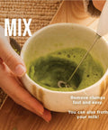 Hand using Electric Matcha Whisk And Milk Frother With One Button Operation For Barista Style Foamy Green Tea And Lattes