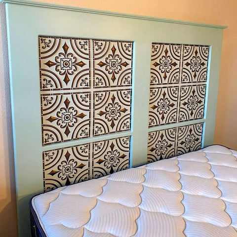 Bed headboard featuring copper faux tin PVC ceiling tiles 2x2 glue up easy install paintable tin look ceiling tiles for quick DIY makeover