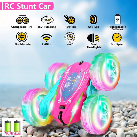 Pink Remote Control Car For Girls That Flips 360 Degrees on rocky surface, double-sided with bright wheel lights, rechargeable batteries included.