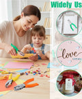 A woman and child using Grab And Go Six Piece Craft Hole Punchers Set With Handheld Metal Punches for DIY scrapbooking.