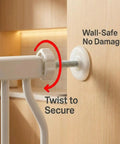 Close-up of white pressure-mounted narrow baby gate for small dogs showing twist-to-secure mechanism on door frame.